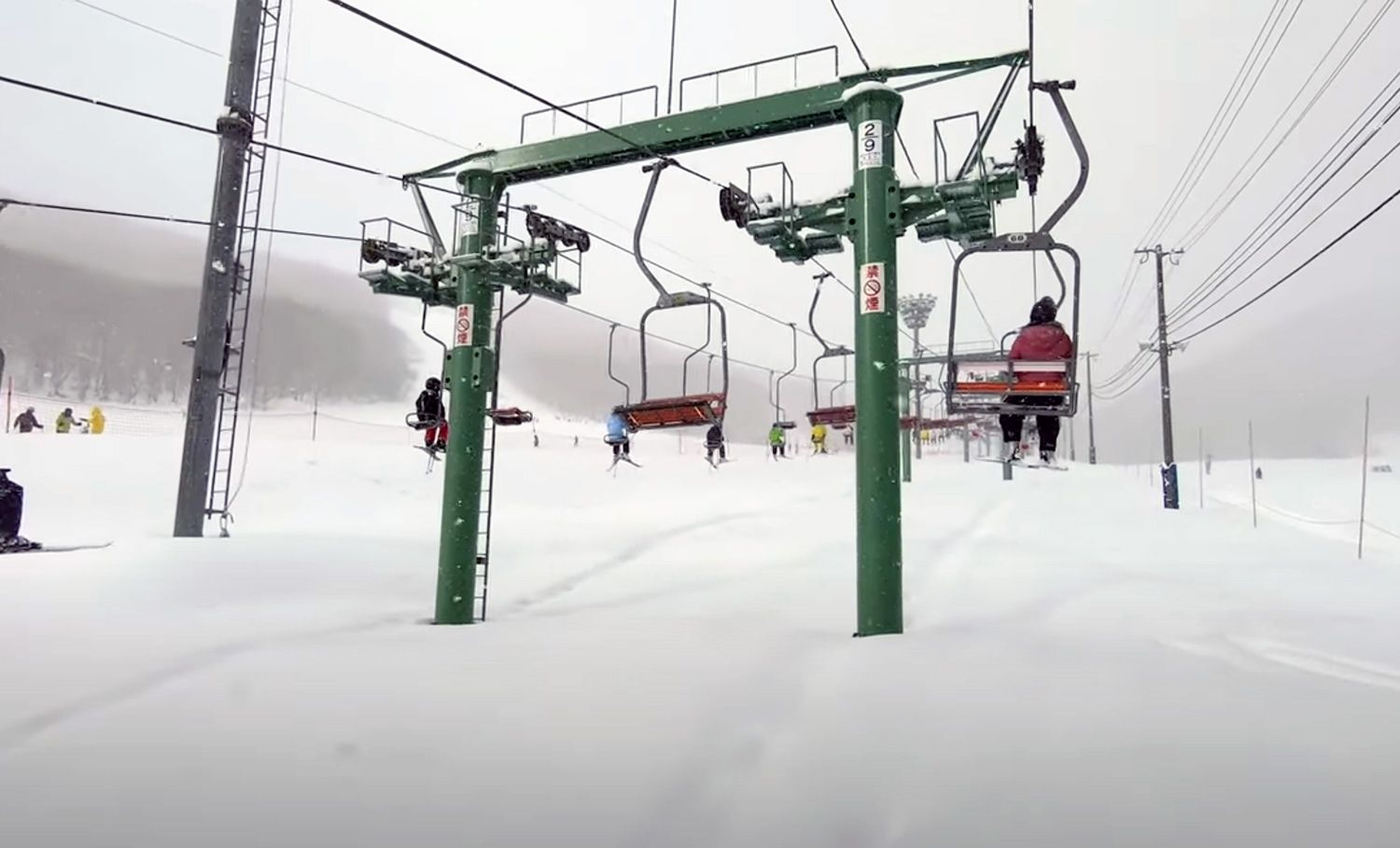 Ski lifts over a blanket of japow at Moiwayama