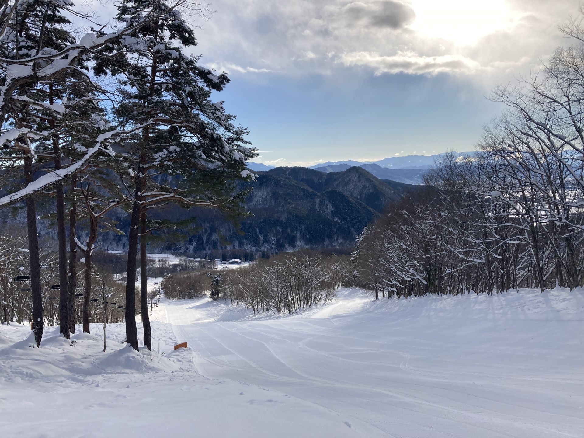 Groomed runs at Hakuba 47 on a blue bird day