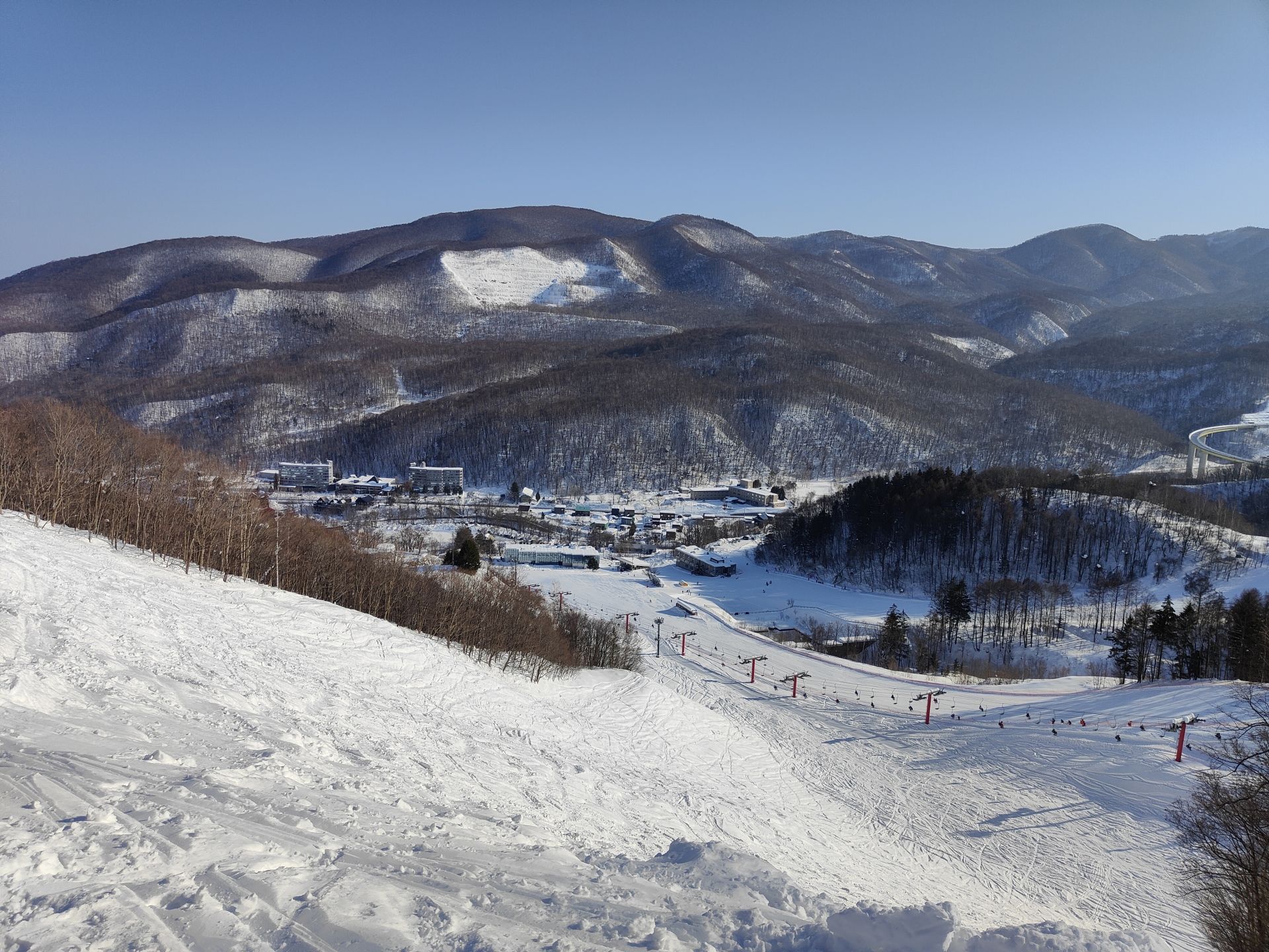 Looking down a black run to the village in the valle at Asarigawa Onsen