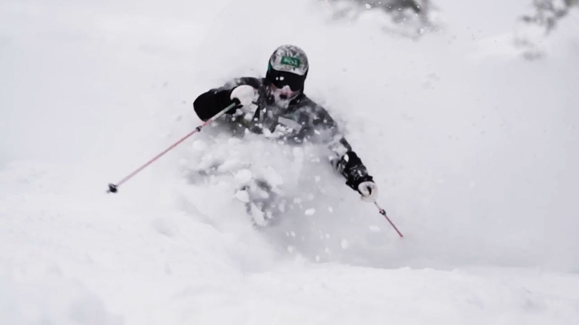 Skier hitting a nice patch of fresh japow at Okushiga Kogen