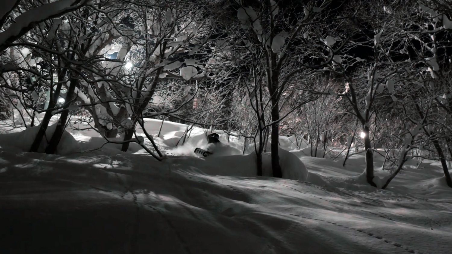 Snowboarder enjoying some quality snow when night boarding